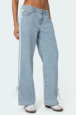 Light blue jeans with white stripes on a white background
