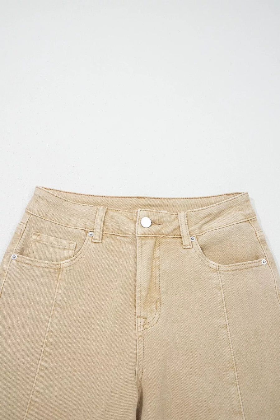 Beige jeans on a white background