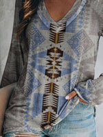 Person wearing a patterned sweater with a neutral background