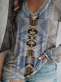 Person wearing a patterned sweater with a neutral background