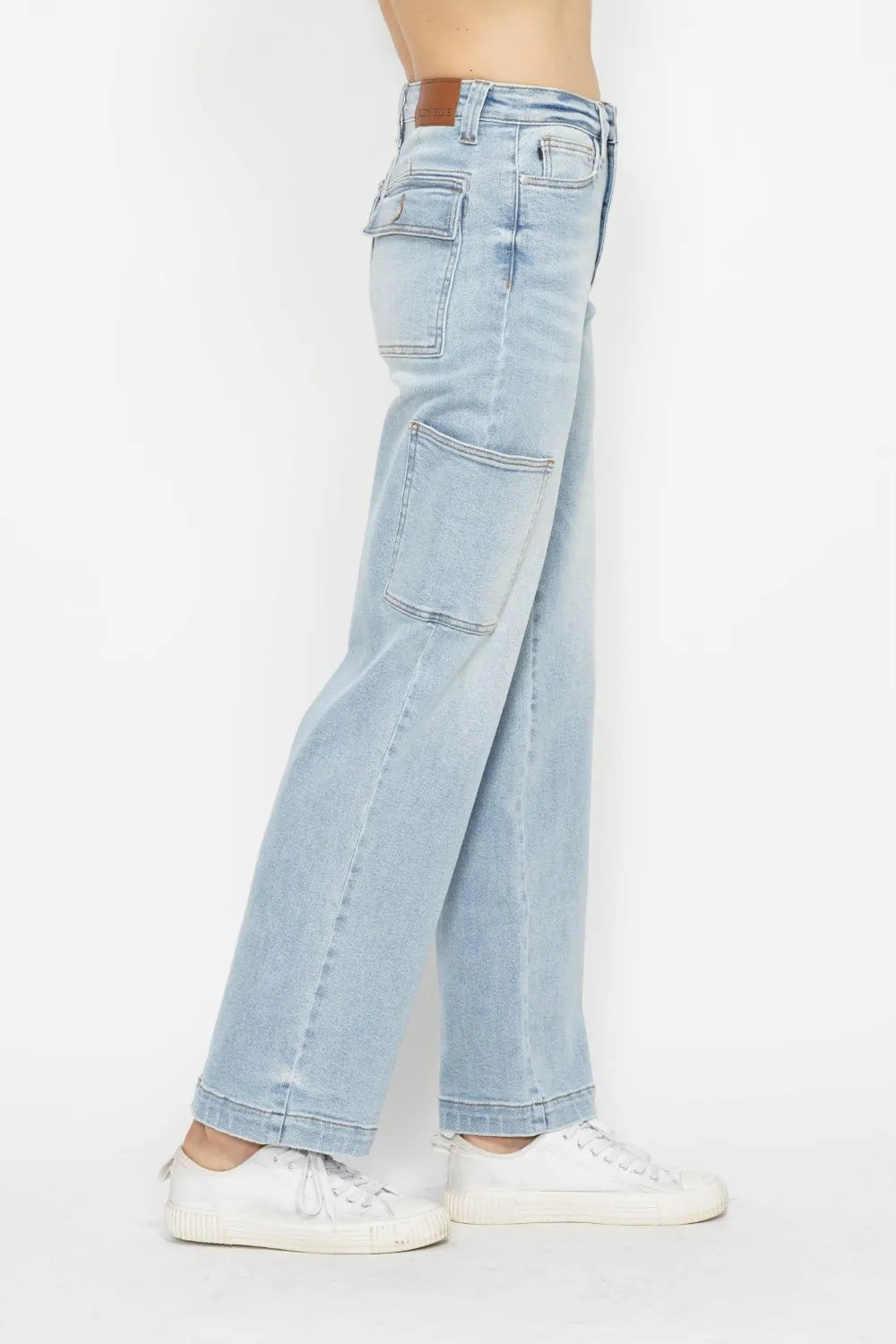 Light blue jeans worn by a person on a white background