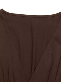 Close-up of a brown garment with a deep neckline on a white background
