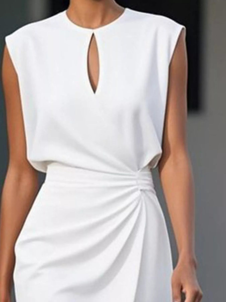White dress with a keyhole neckline on a blurred background