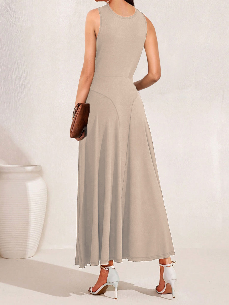 Woman wearing a beige sleeveless dress with a white background