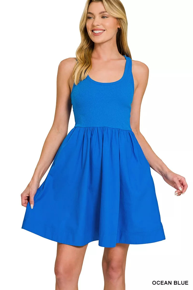 Woman wearing a blue dress on a white background