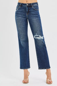 Blue jeans with slight distressing on a white background
