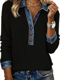 Black sweater with denim collar and cuffs worn by a person