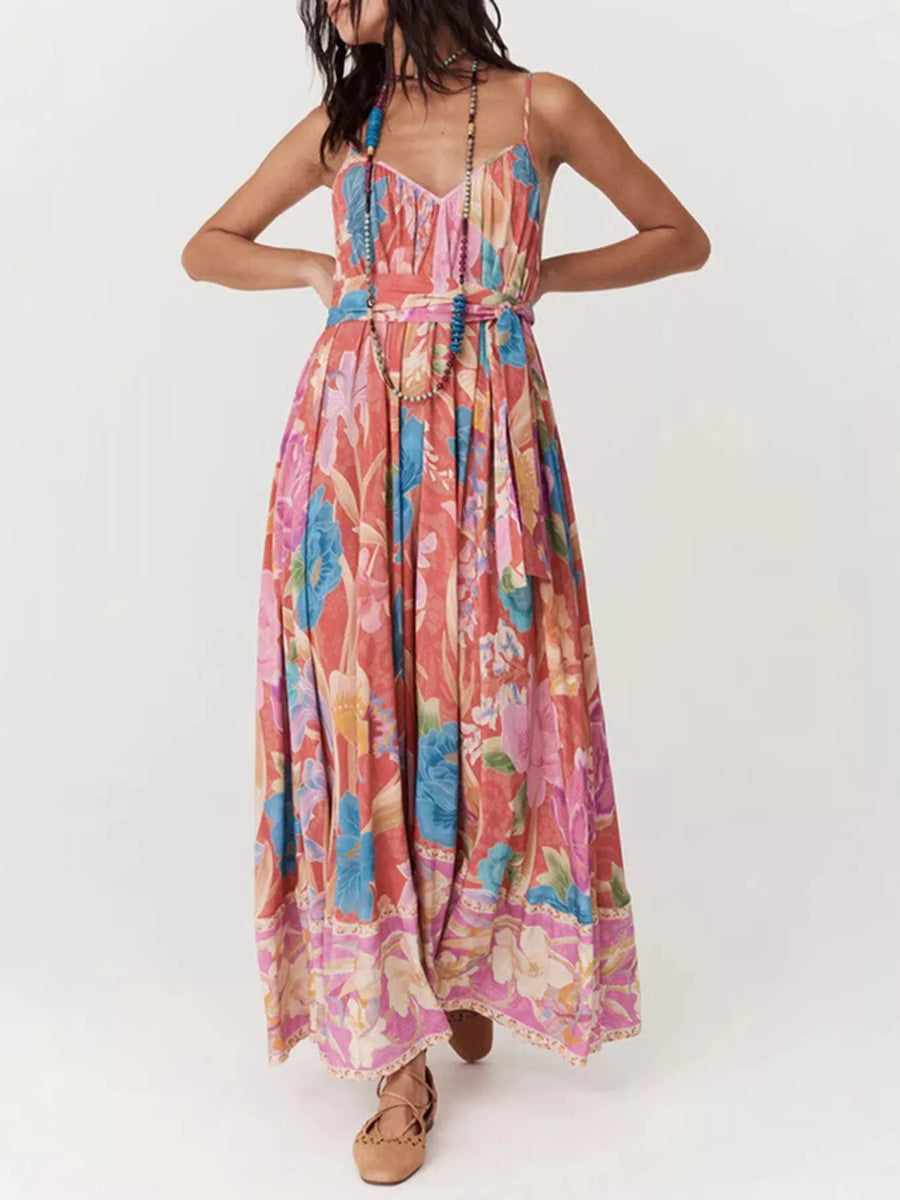 Woman wearing a colorful floral dress on a white background