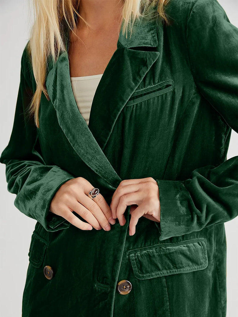Person wearing a green coat with a neutral background