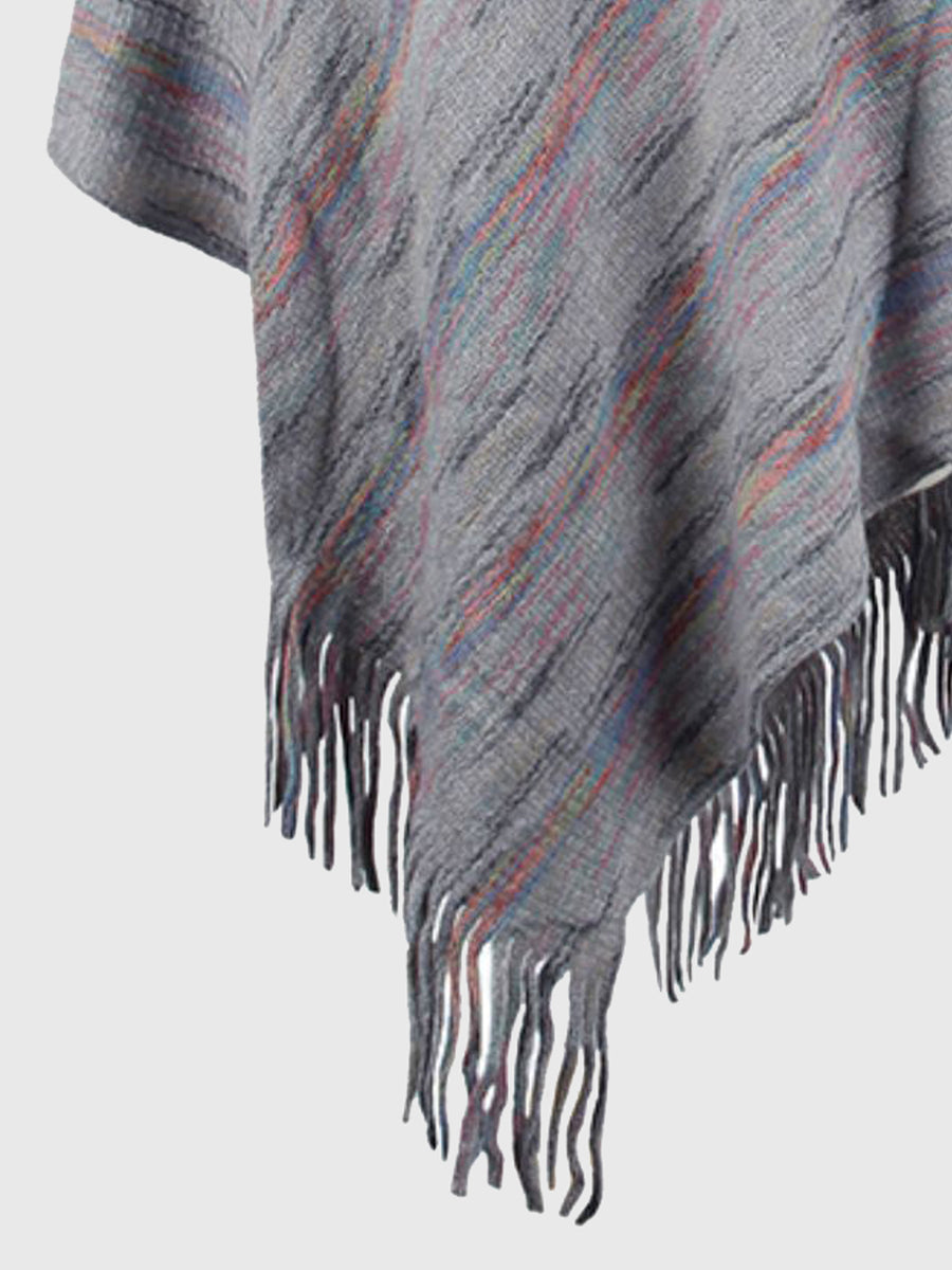 Gray poncho with multicolor pattern and fringes on a white background