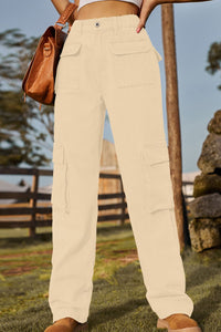 Person wearing beige pants with a blurred outdoor background