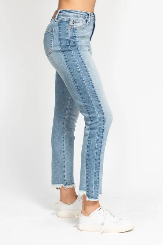 Light blue jeans worn by a person on a white background
