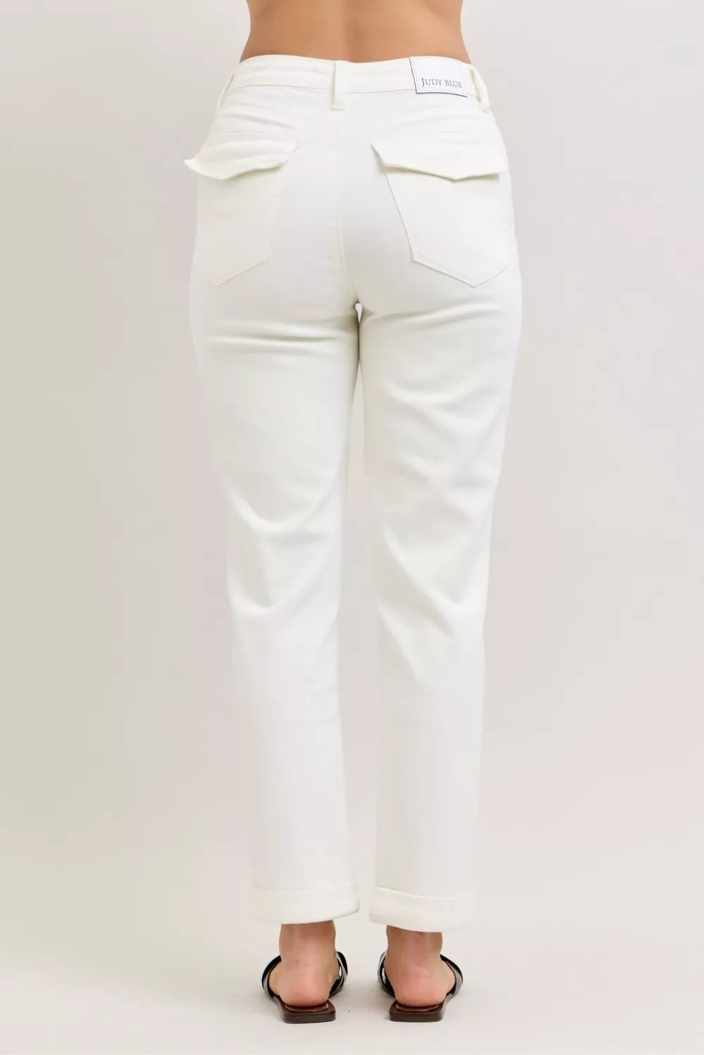 White jeans on a plain background