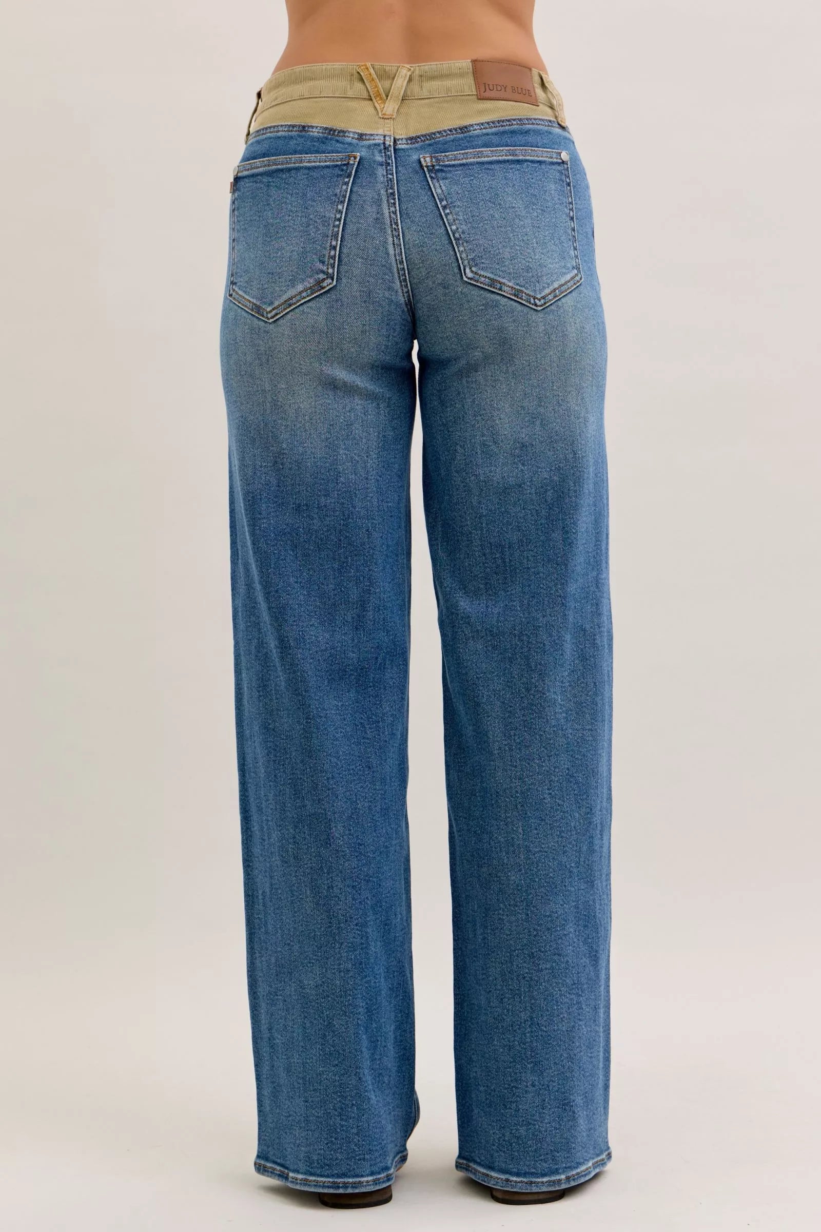 Blue jeans on a plain background