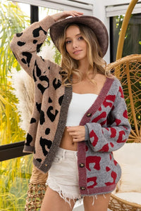 Woman wearing a patterned cardigan in an outdoor setting