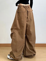 Brown wide-leg pants worn by a person on a plain background