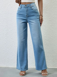 Light blue jeans worn by a person on a white background