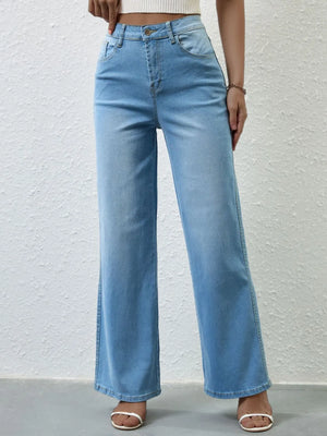 Light blue jeans worn by a person on a white background