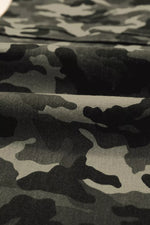 Close-up of camouflage fabric with black and gray pattern