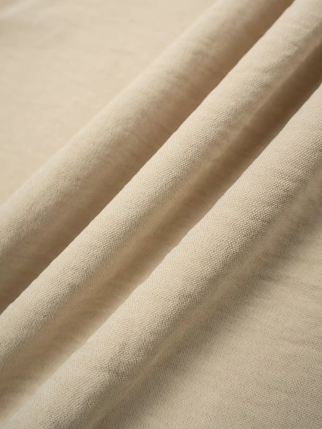 Close-up of beige fabric with folds