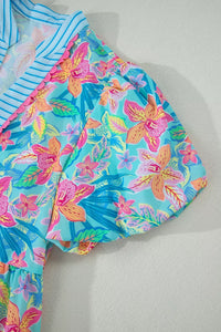 Colorful floral swimsuit on a light gray background