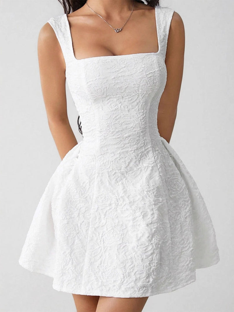 White dress with a subtle pattern on a plain background
