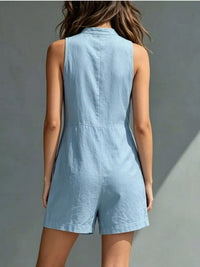 Light blue romper worn by a person on a gray background