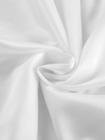 Close-up of white fabric with folds
