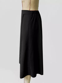 Black skirt on a mannequin against a white background