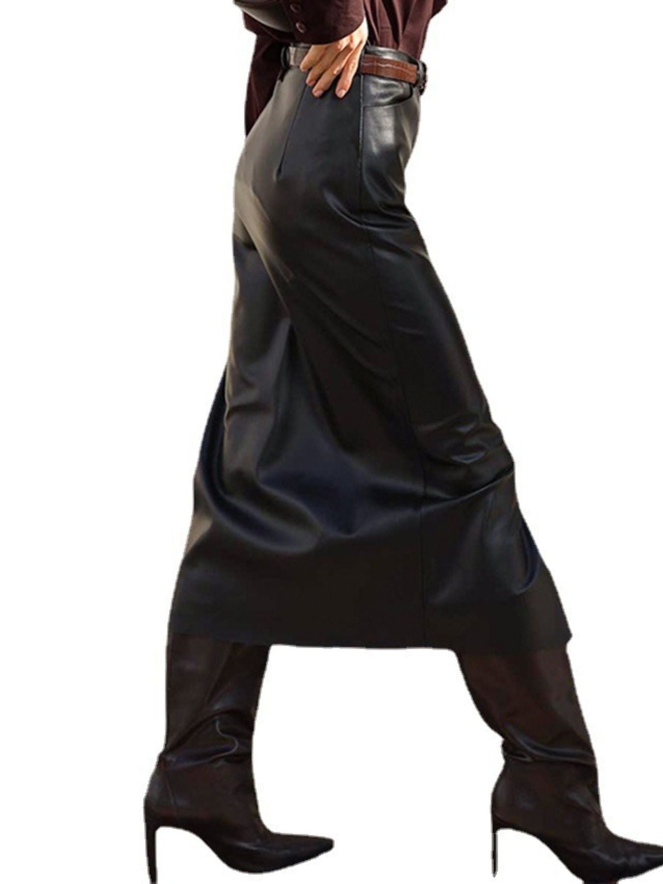 Person wearing a long black leather skirt and high-heeled boots on a white background