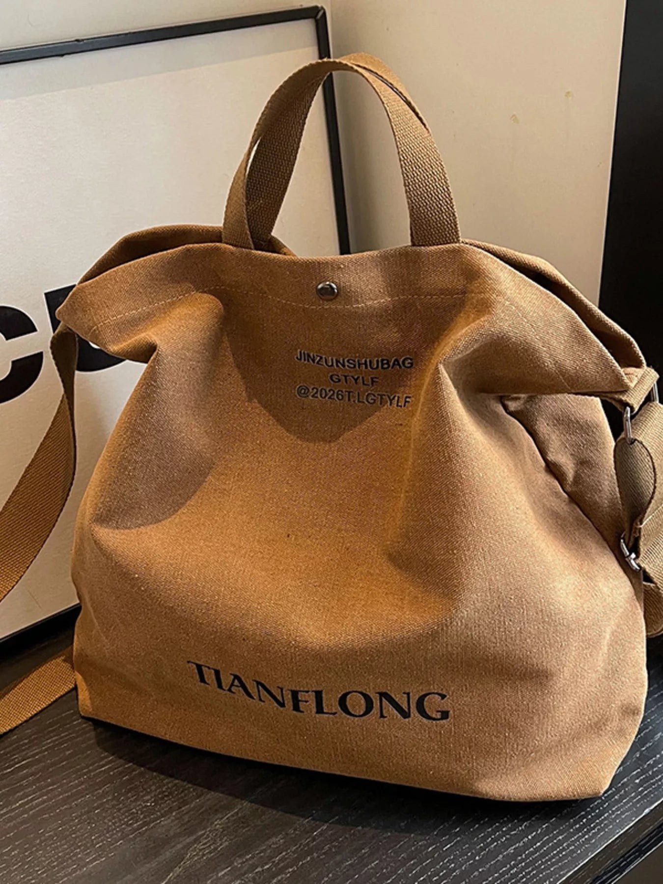 Brown bag with 'HANELONG' branding on a wooden surface.