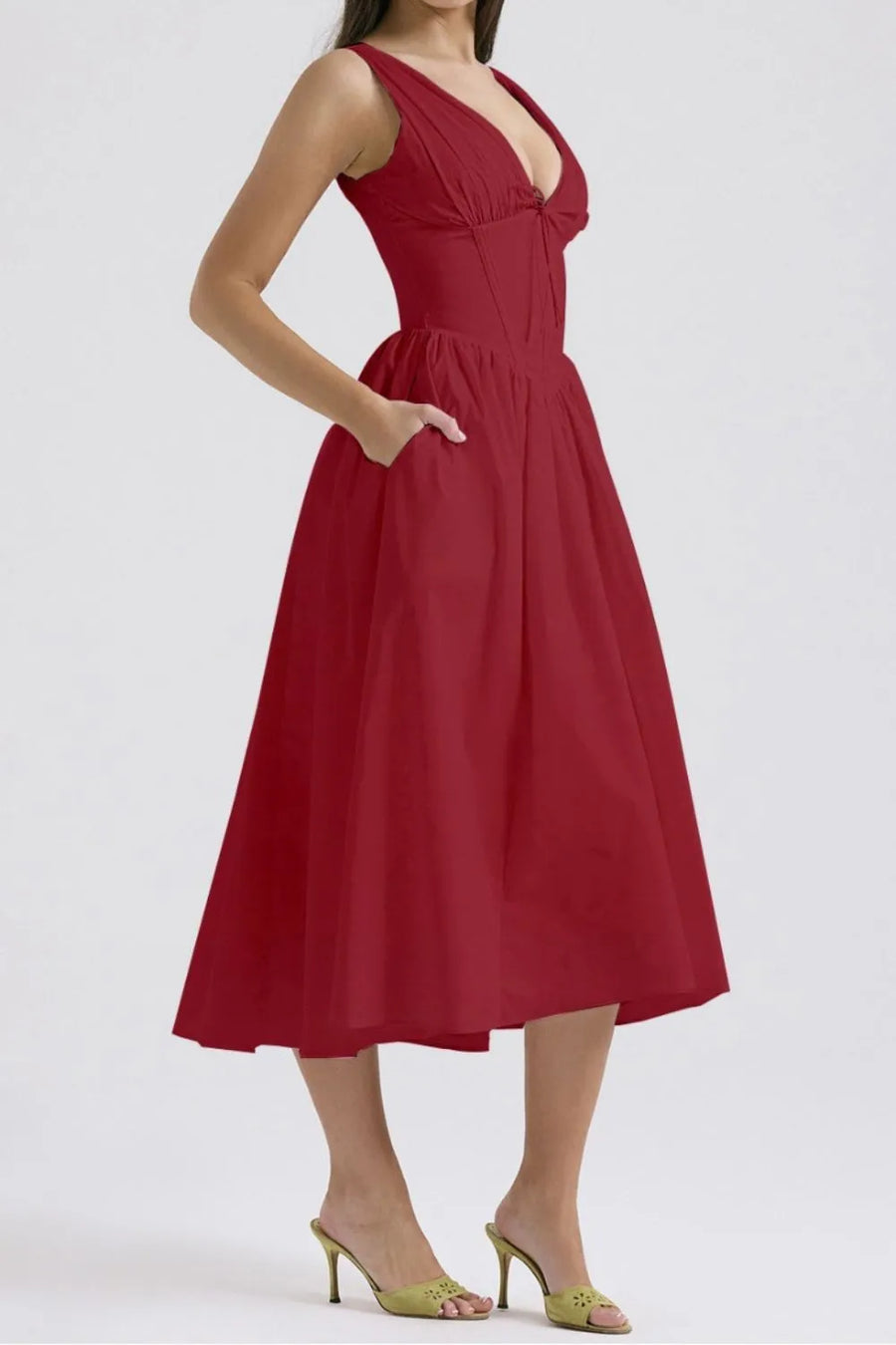 Red dress worn by a model on a white background