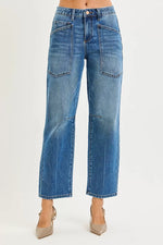 Blue jeans worn by a person on a white background