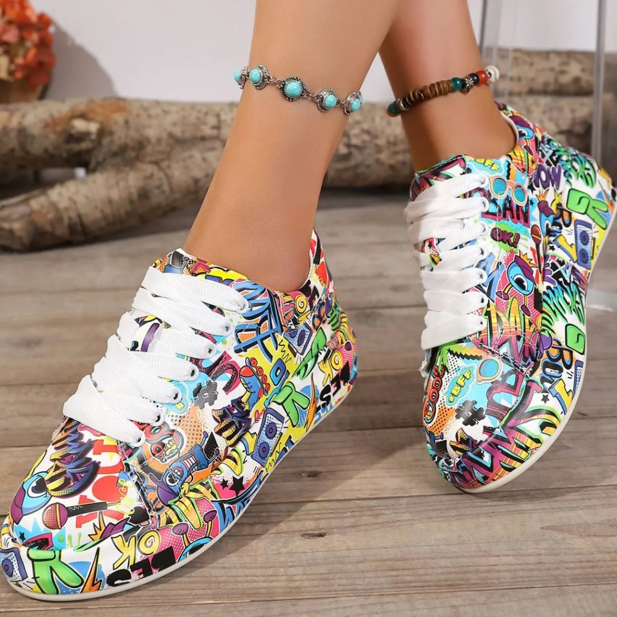 Colorful sneakers with a abstract pattern worn by a person on a wooden floor.