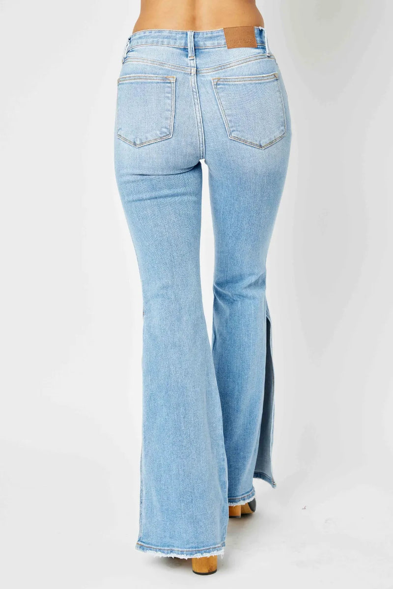 Light blue flared jeans on a white background