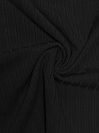 Black textured fabric with folds