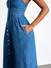 Blue denim dress with buttons on a white background