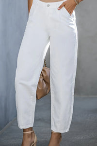 White pants worn by a person with a neutral background