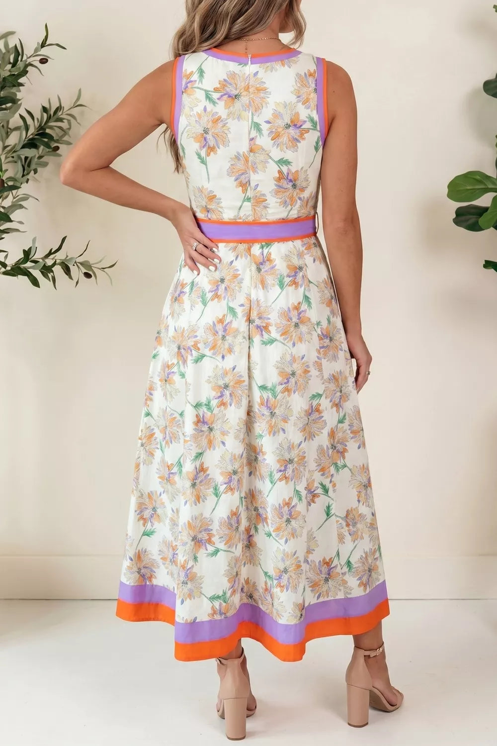 Woman wearing a floral dress with a white background