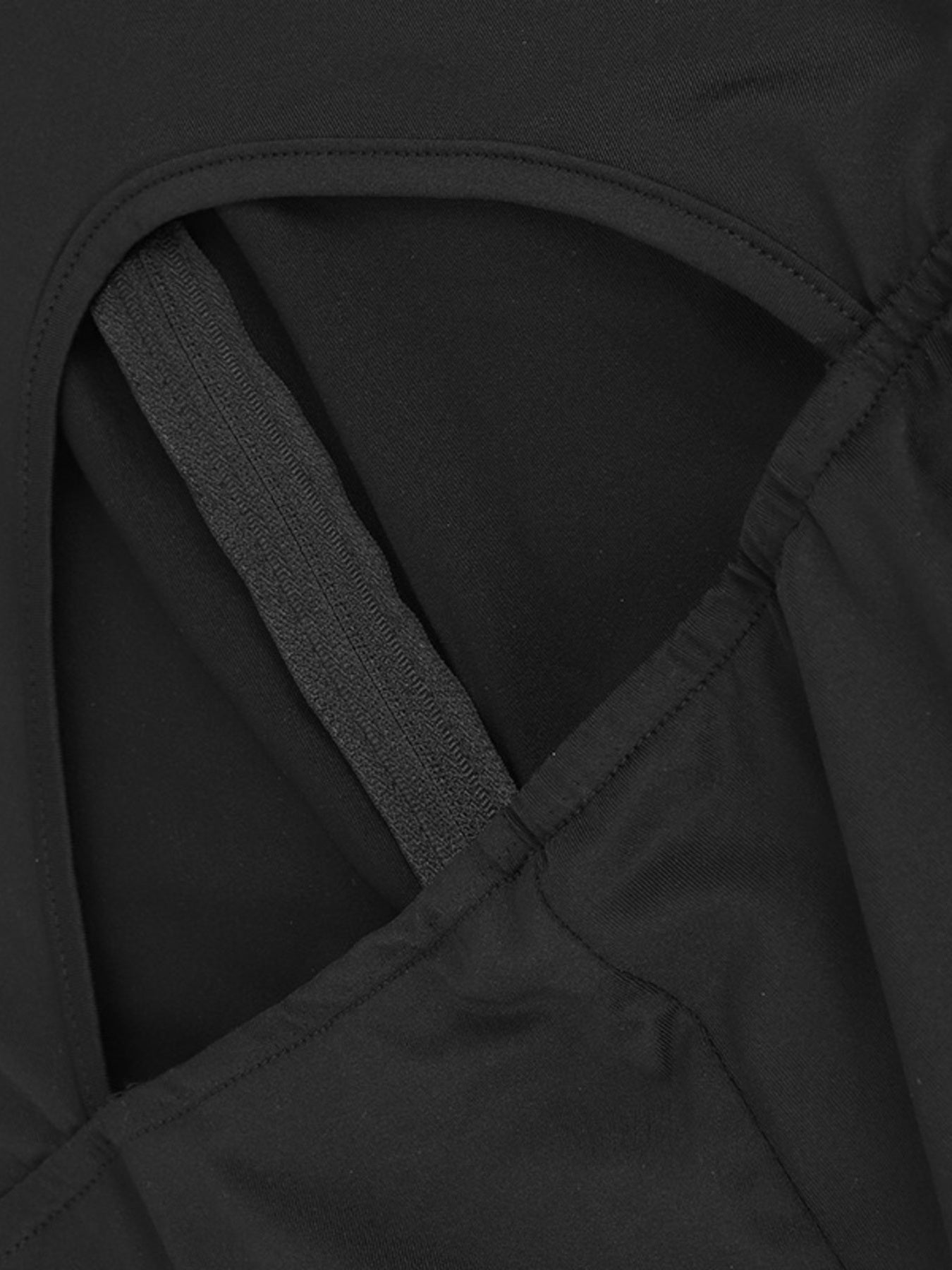 Close-up of a black garment with a criss-cross design.