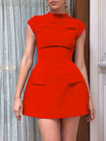 Red dress worn by a person with a neutral background