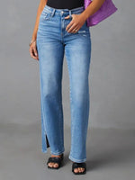 Person wearing light blue jeans on a gray background