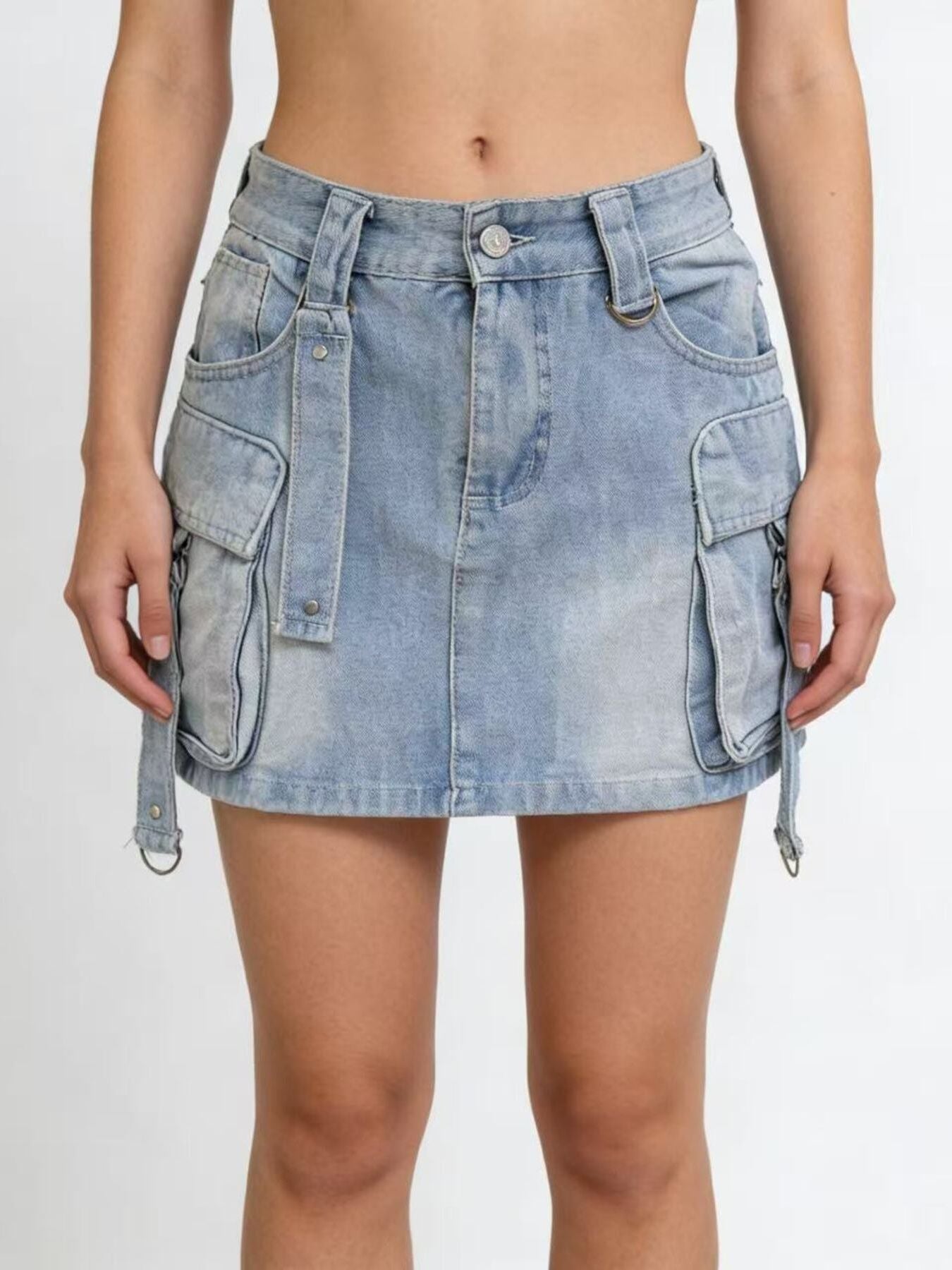 Light blue denim skirt with multiple pockets on a white background
