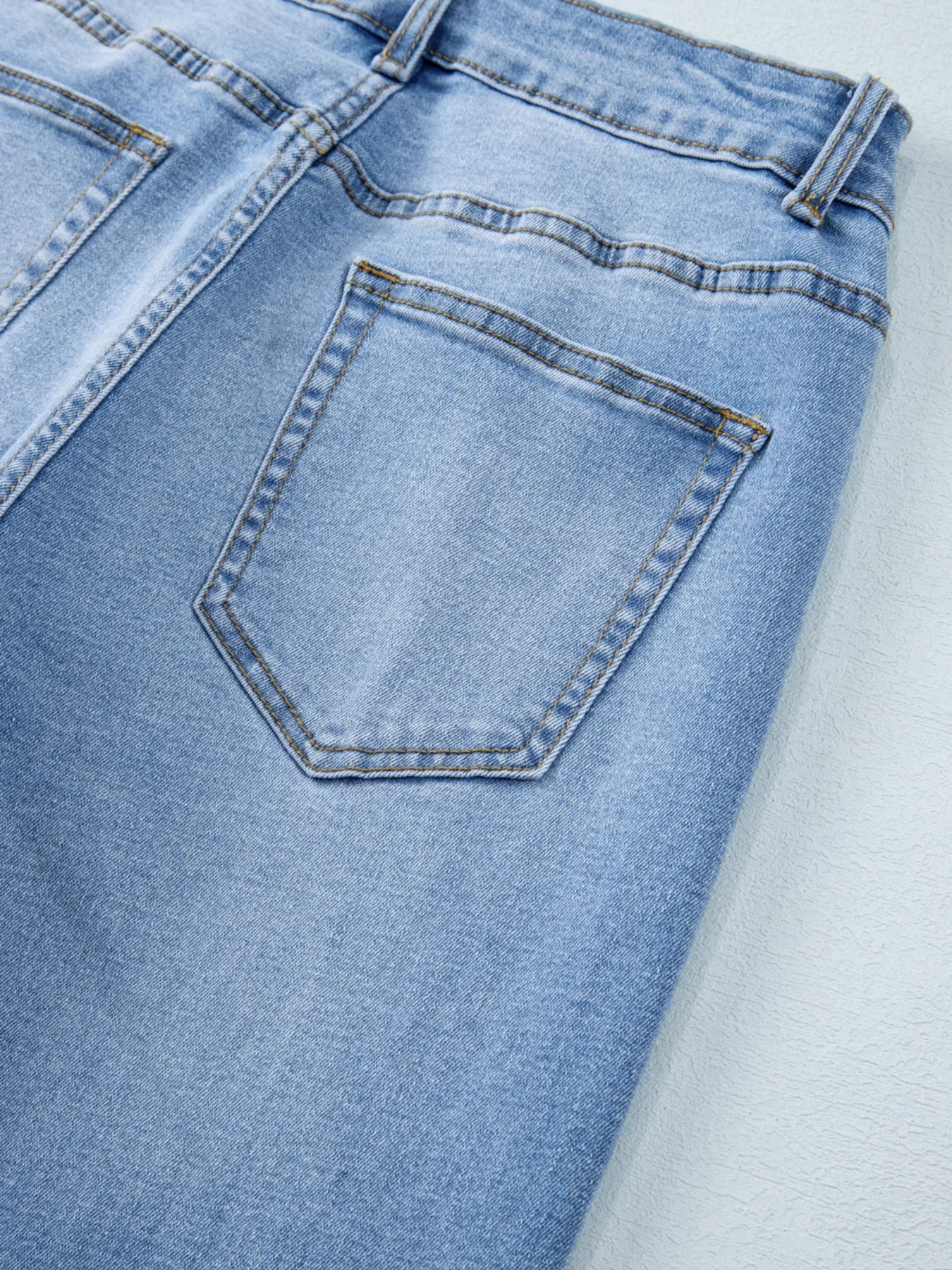Close-up of a blue denim pocket on jeans.