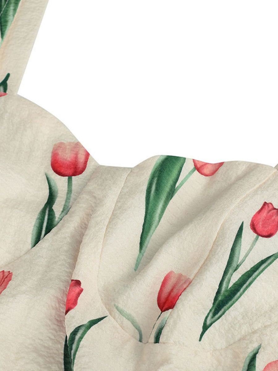 Close-up of a fabric with red tulip pattern on a white background