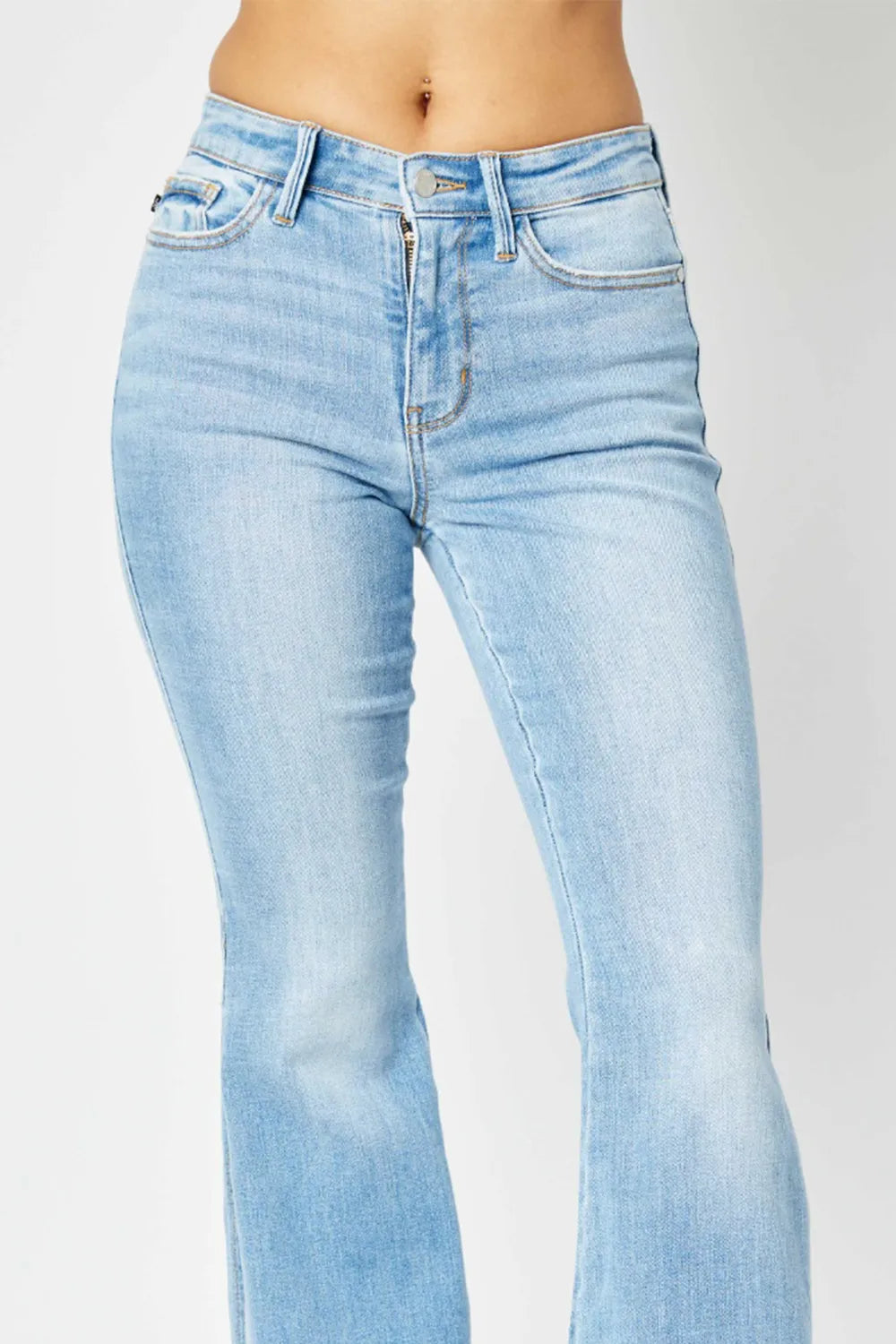 Light blue jeans on a plain background