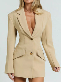 Beige blazer dress worn by a model on a light gray background