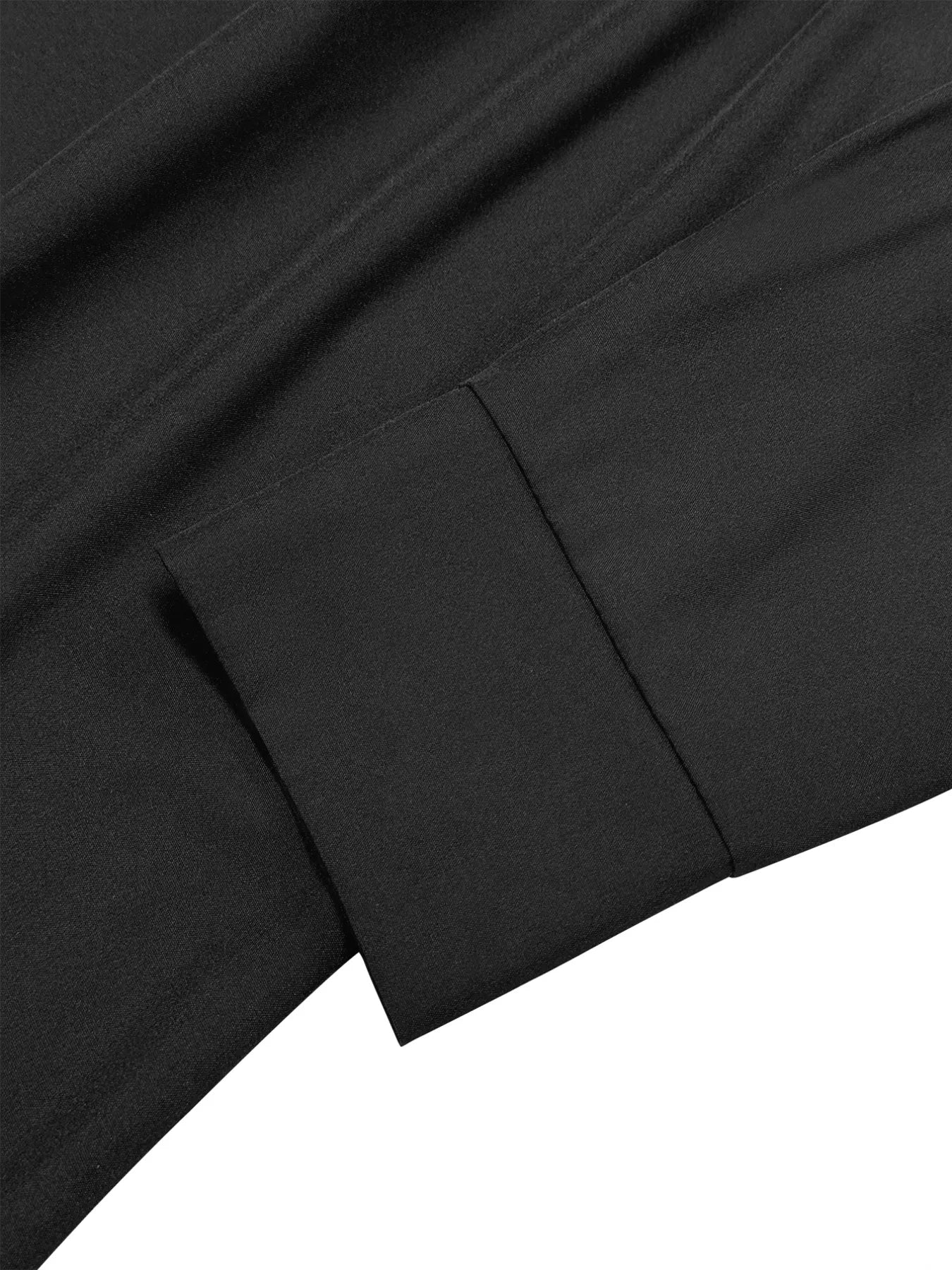 Close-up of black fabric with folds on a white background