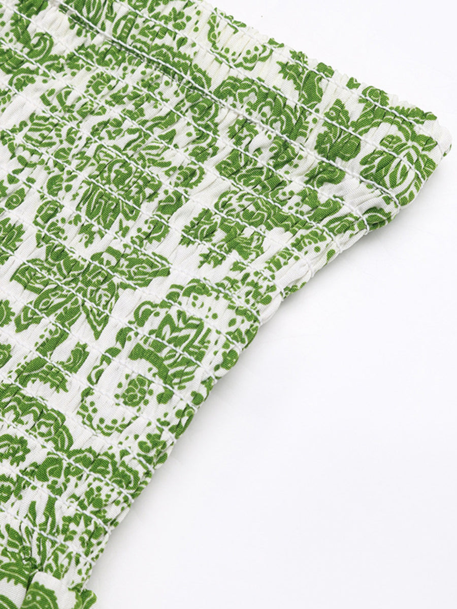 Green patterned fabric on a white background