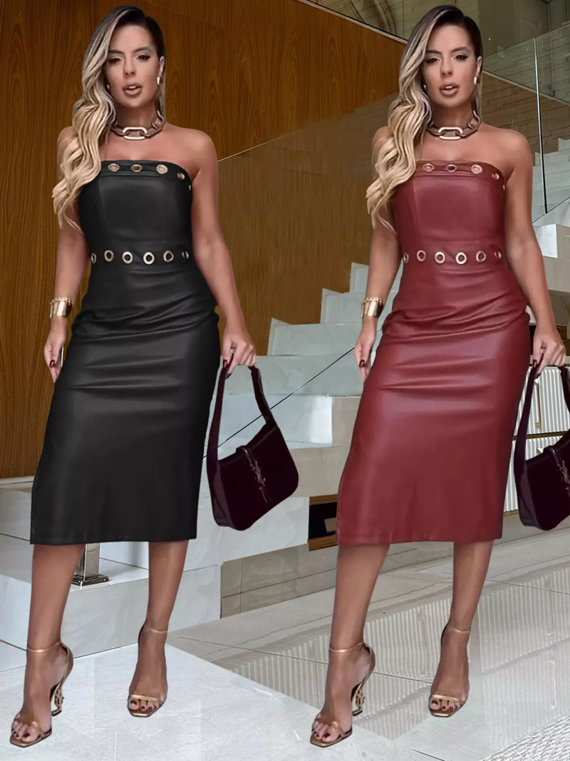 Two women wearing black and red leather dresses with matching handbags.